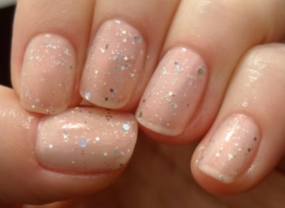{Sparkle polish over a sheer nude.}